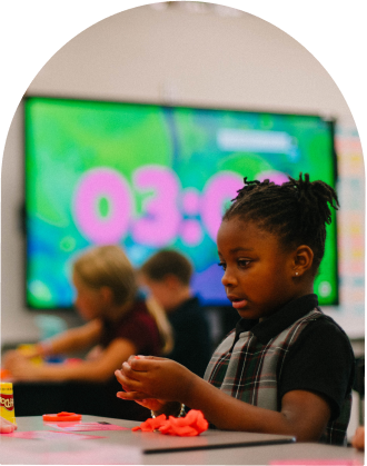 girl playing with playdough